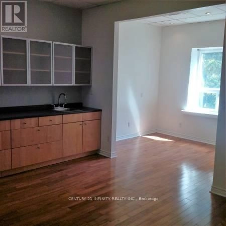 200 - 323 Kerr Street, Oakville, Ontario  L6K 3B6 - Photo 1 - W12354536